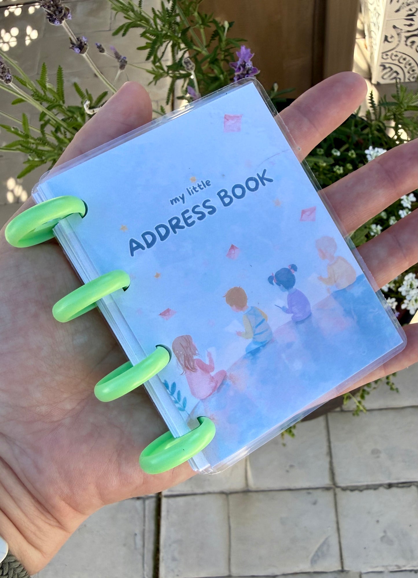 Mini Address Book in use - kid filling in pen pal and family addresses